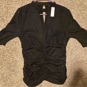 New York & Company brand new shirt with the tags still on. Black sheer material